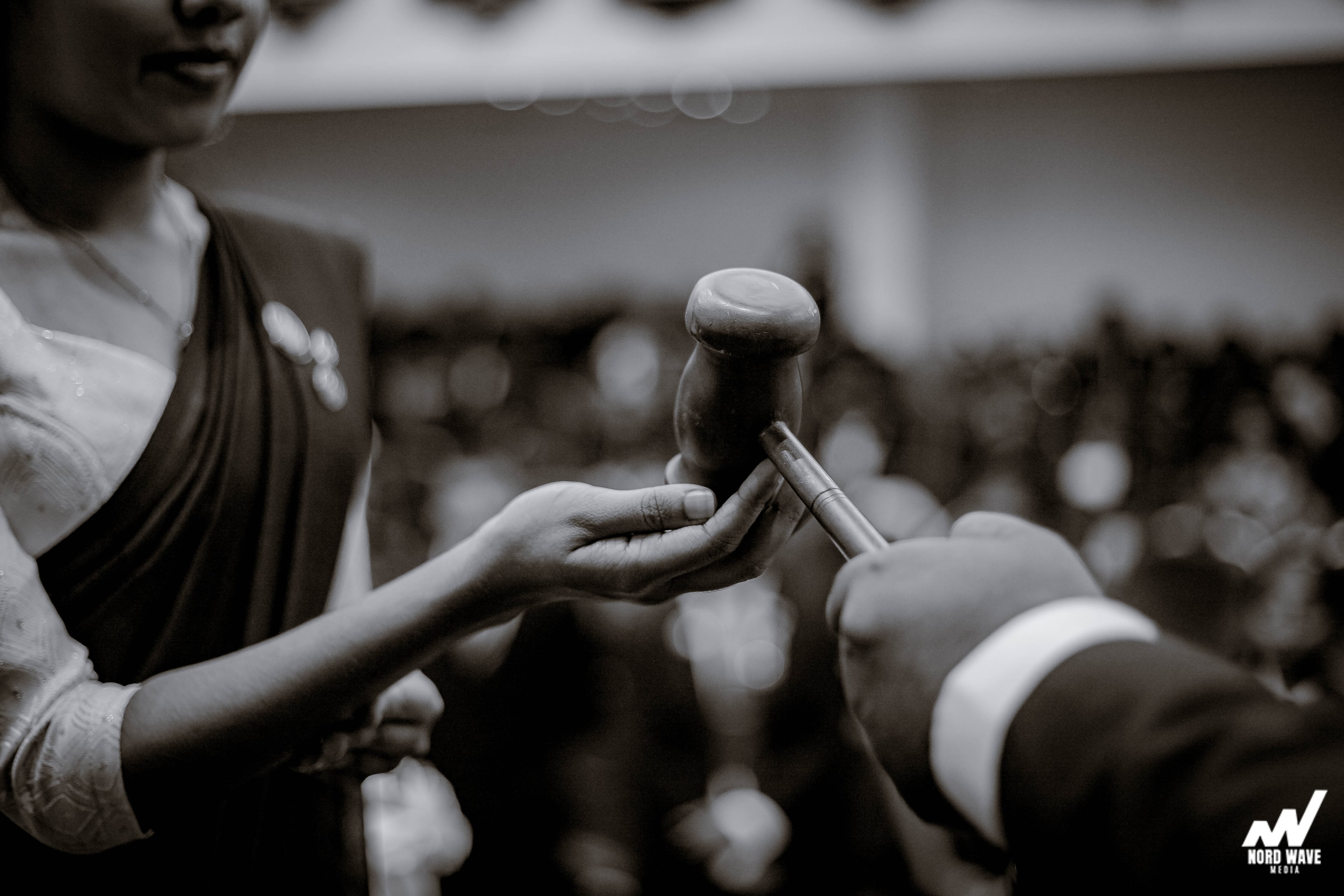 Black and white: the gavel passes from hand to hand during the ceremony